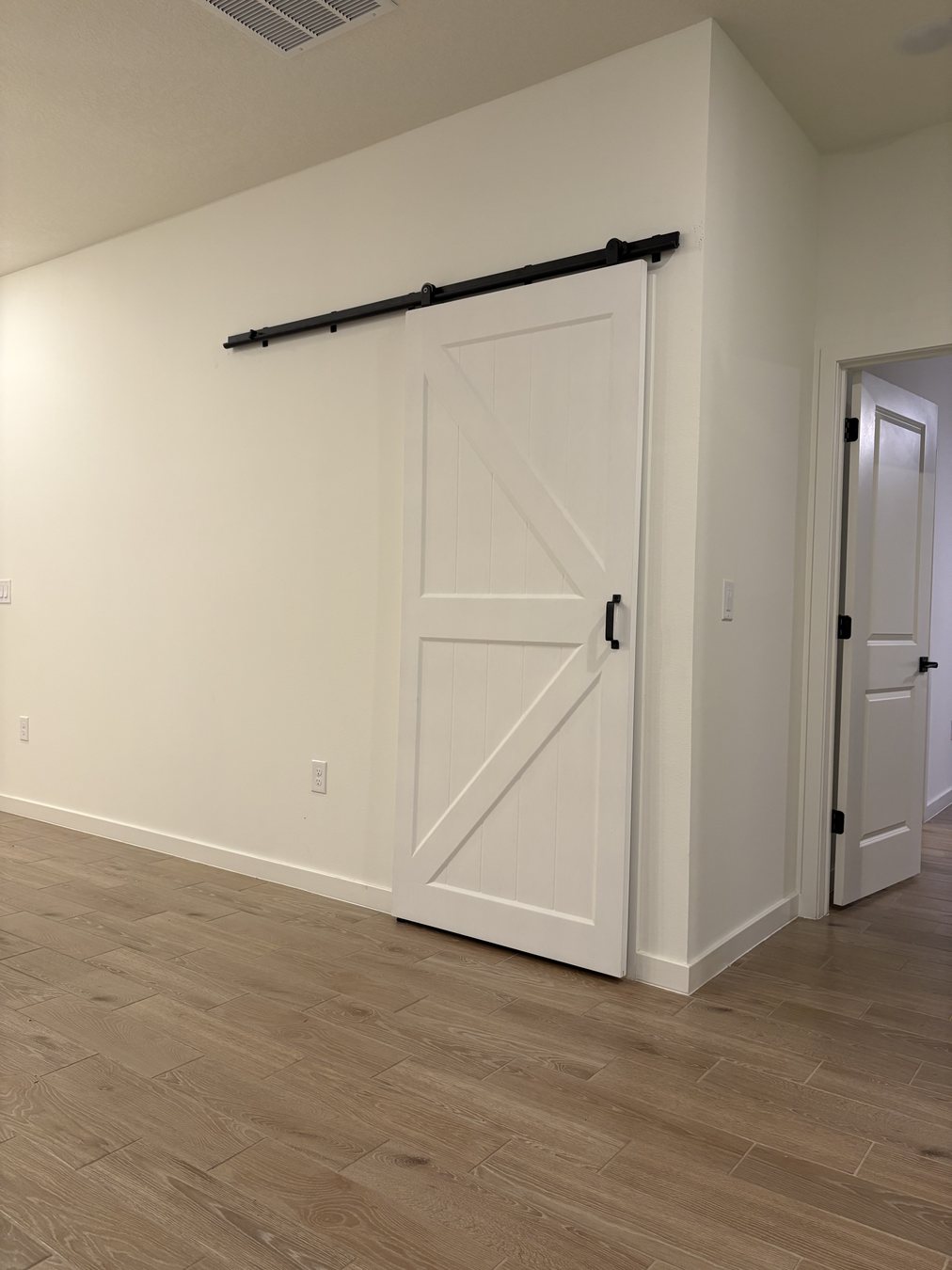Custom built-in storage with closed cabinet by KDP Builders