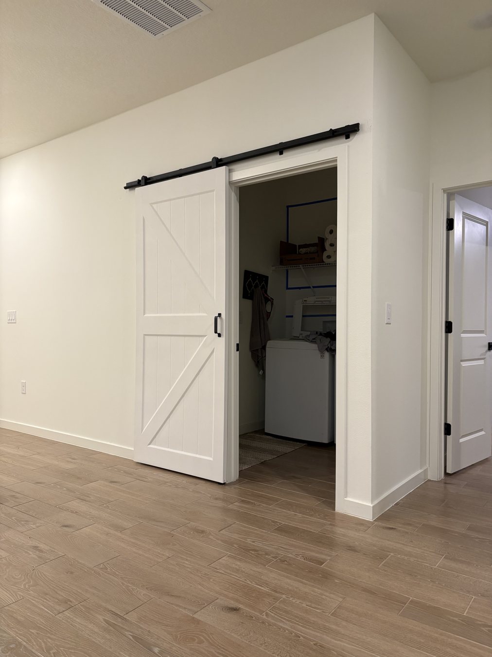 Custom built-in storage with open cabinet by KDP Builders