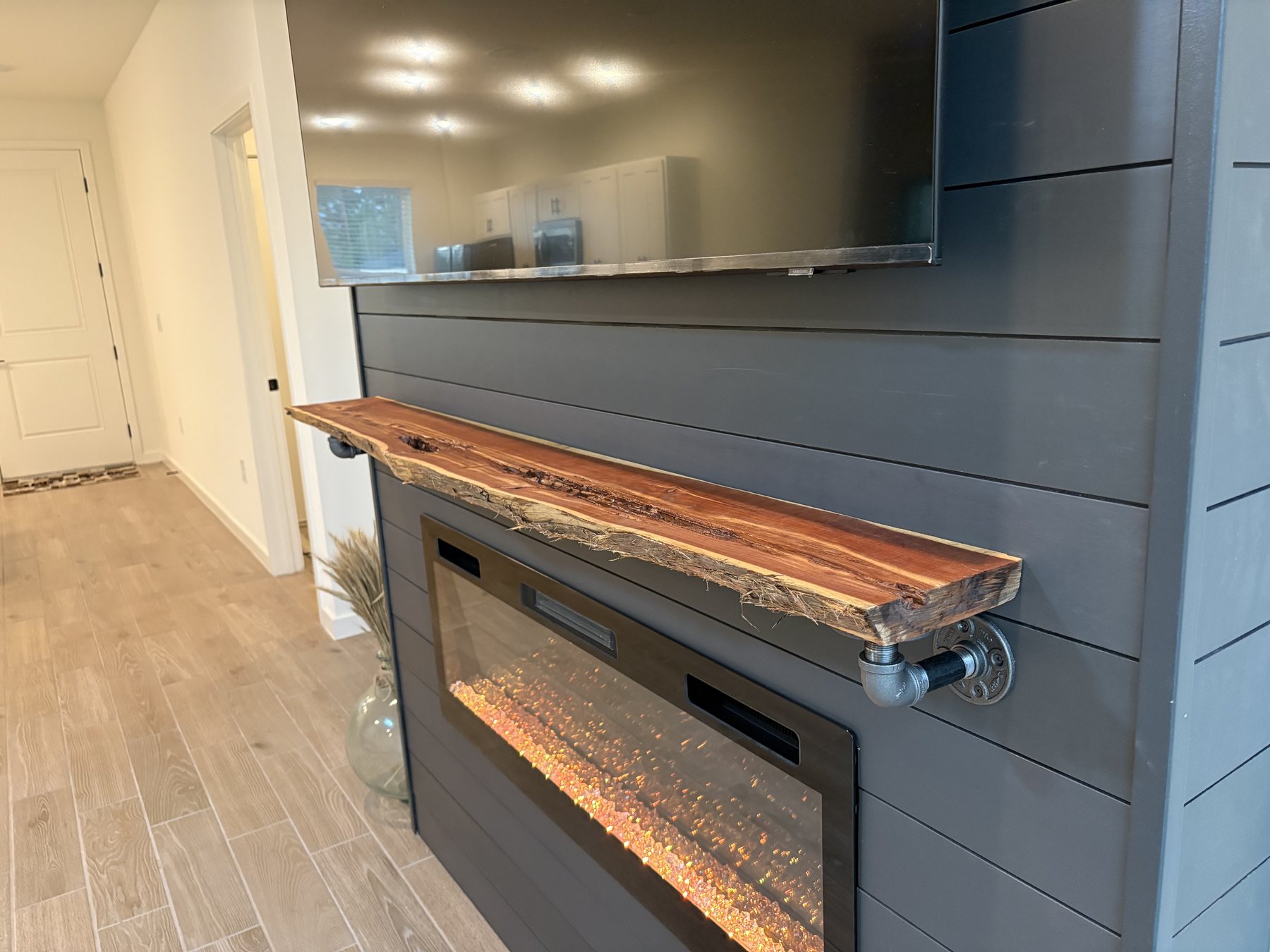 Custom fireplace mantel and finish detail by KDP Builders