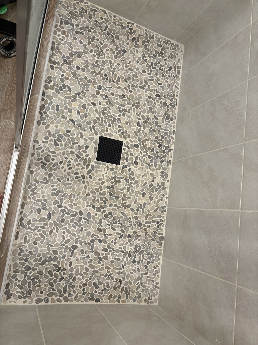 Shower floor tile installation by KDP Builders