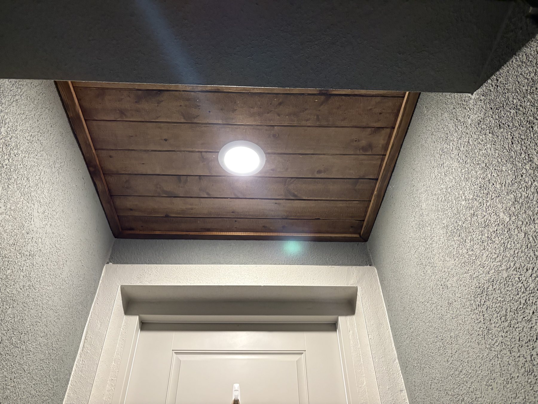 Tongue and groove wood entry ceiling by KDP Builders